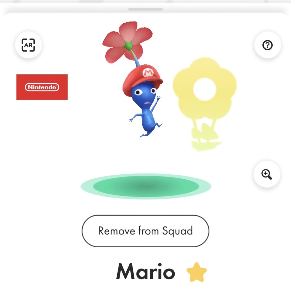 A screenshot from the game #PikminBloom. It is a blue #Pikmin wearing a #Mario cap doing the iconic Mario jump pose.