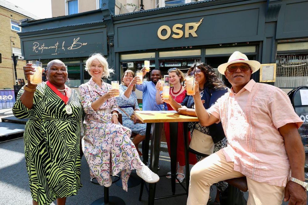 Deputy Mayor Justine Simons and others hold up drinks to the camera outside OSR Restaurant and Bar