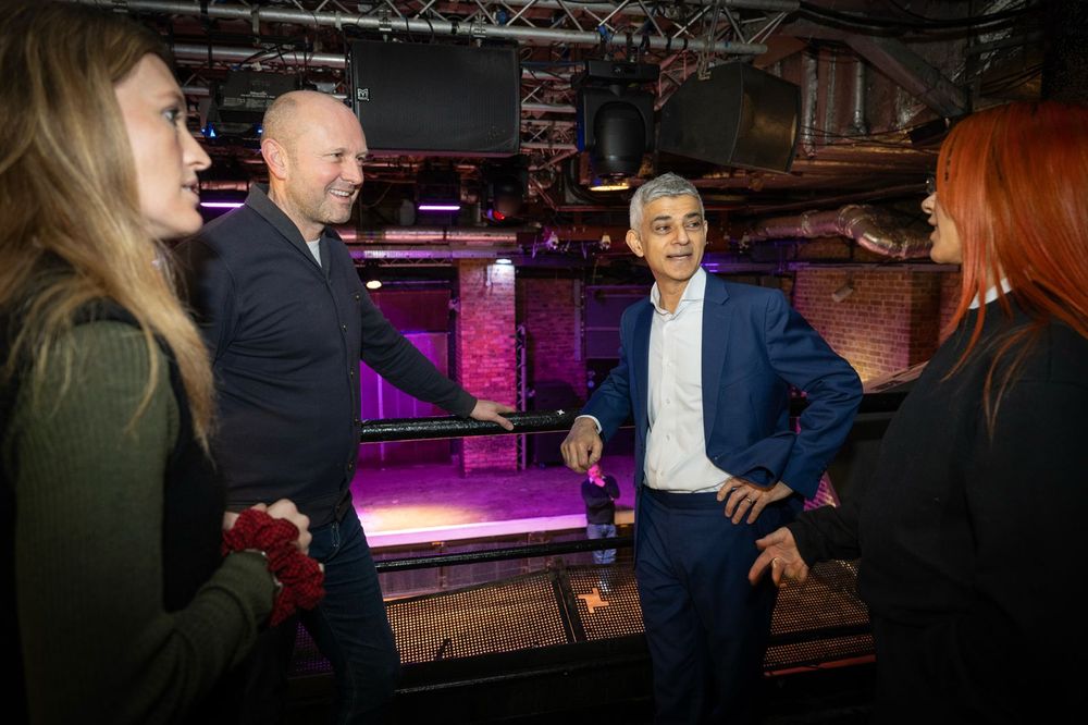 Mayor of London Sadiq Khan stands inside Fabric London nightclub, speaking with representatives of the venue.