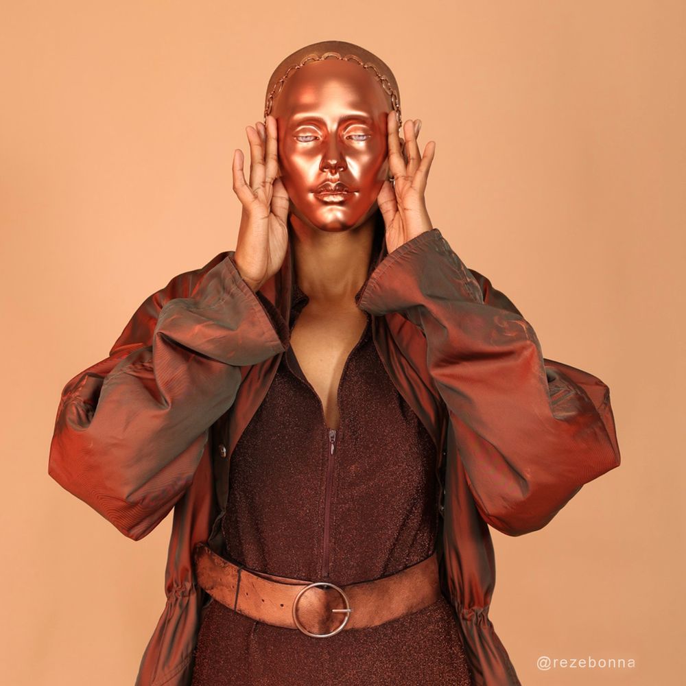 In “Content,” the transformation reaches its peak. The human model stands alone, facing the camera, her face replaced entirely by the cyborgs. This image captures the moment of full assimilation into a digital identity, raising questions about the cost of this transformation on our genuine sense of self as well as relinquishing all of our data to train AI models.