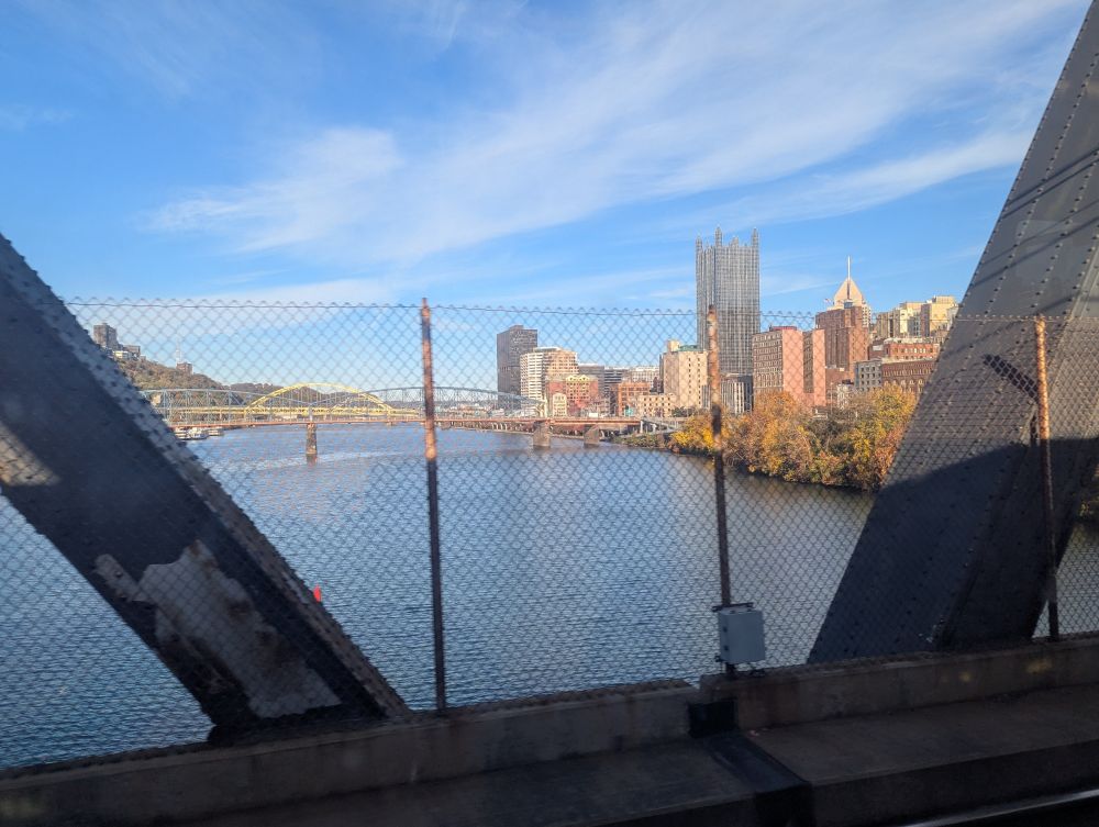 downtown Pittsburgh as seen from the panhandle bridge; view is down the monongahela, the Smithfield bridge is visible as are the glass center n highmark building