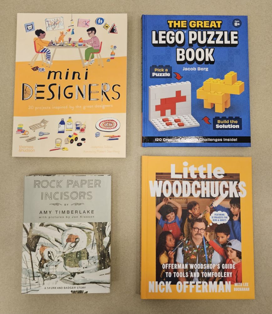 Four children's books on a table, clockwise from top left: Mini Designers by Josephine Seblon with Robert Sae-Heng, The Great Lego Puzzle Book by Jacob Berg, Little Woodchucks by Nick Offerman, and Rock Paper Incisors by Amy Timberlake with Jon Klassen.