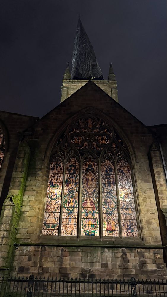 Chesterfield church stained glass window lit up from behind (ie from inside the church).