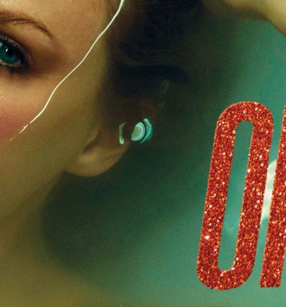 close up of Taylor Swift’s ear submerged in water. A reflected teal square is on her ear 
