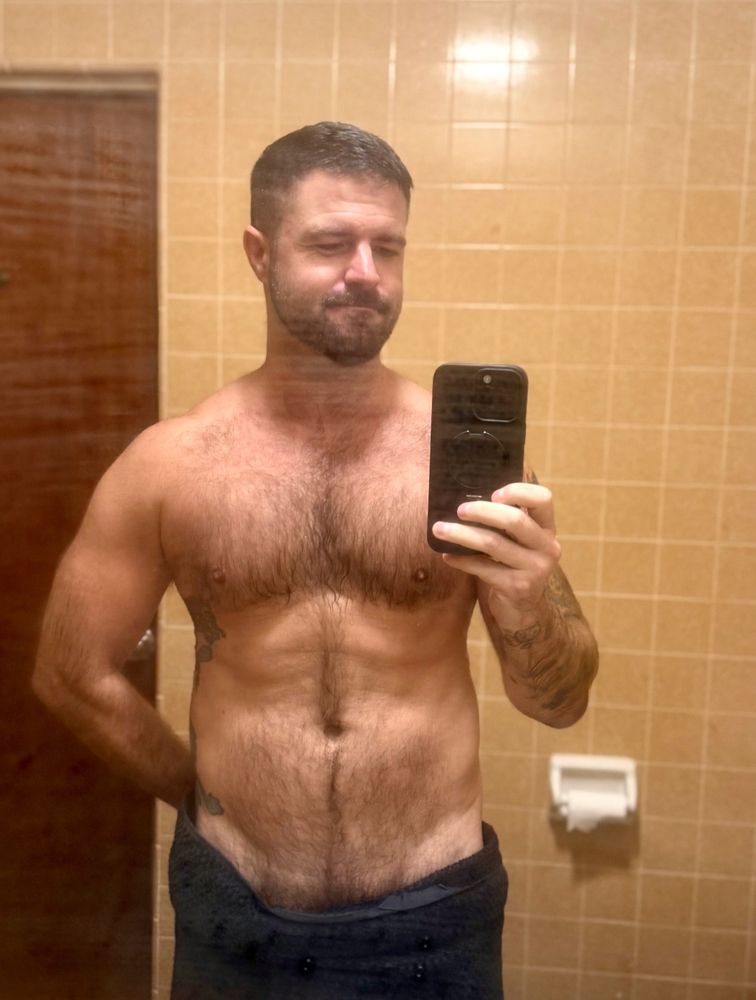 In my bathroom in a towel
