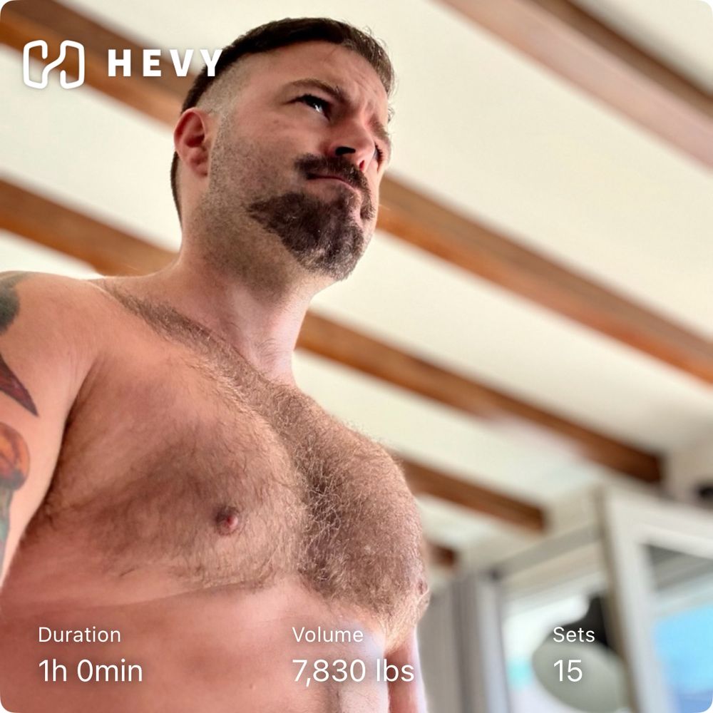 Hevy post workout pic. Standing shirtless in bright room