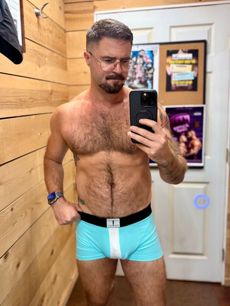 Me in light teal boxer briefs in a fitting room 