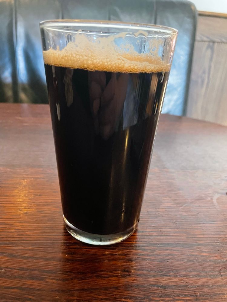 A pint of Oakham Ales’ Root & Branch, a black IPA.