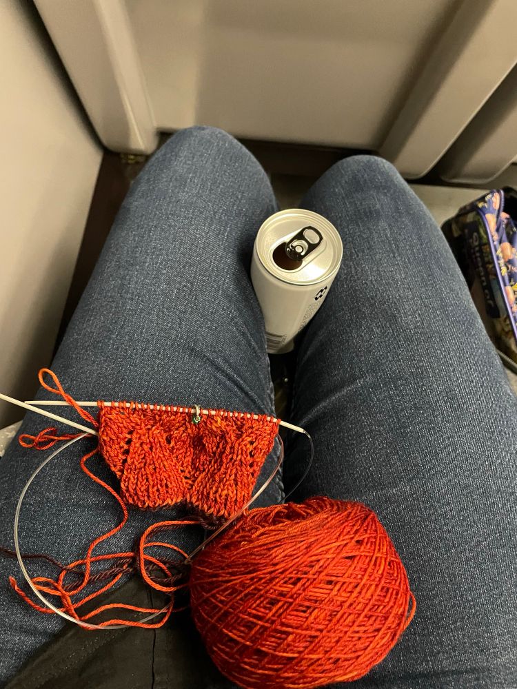 A knitting WIP on my lap as I sit on the train, a gin in a tin held gently between my knees (there was no table)