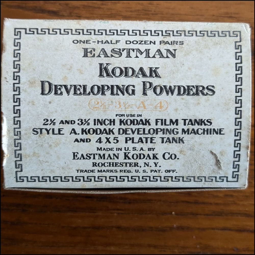 Box of old film development powder from the 1920s. Grey box with line design around the box edges. Text inside line design reads:

Eastman Kodak 
Developing Powders

2 1/2 and 3 1/2 inch developing tanks

Style A. Kodak Developing Machine and 4 X 5 plate tank

Made in the U.S.A. by

Eastman Kodak Co.

Rochester, N.Y.

Trade Marks Reg. U.S. Pat. Off.