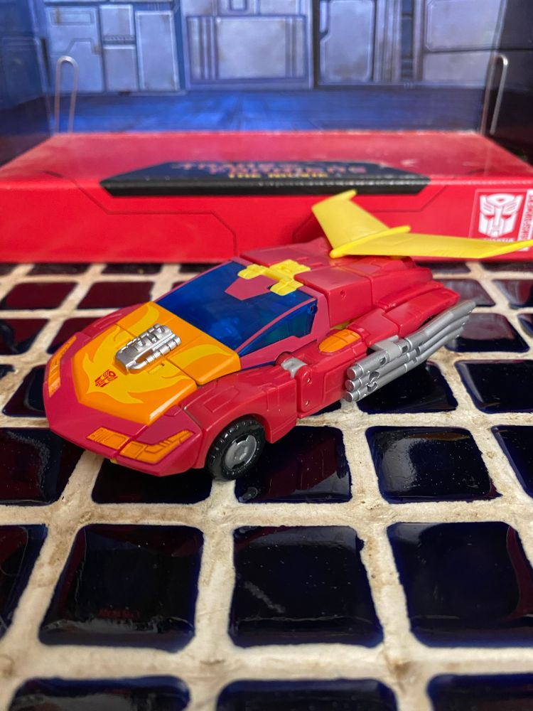A red car with yellow spoiler