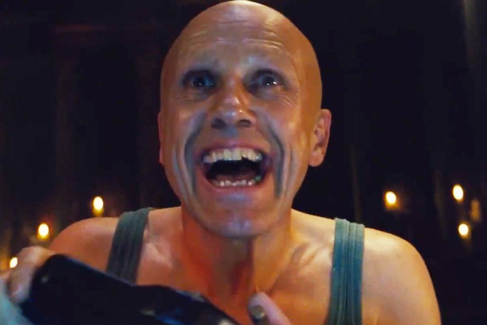 Screen shot of Christoph Walz in the movie Zero Theorem, where the character is driving themselves mad trying to solve a puzzle for their employer using a clunky computer controller.