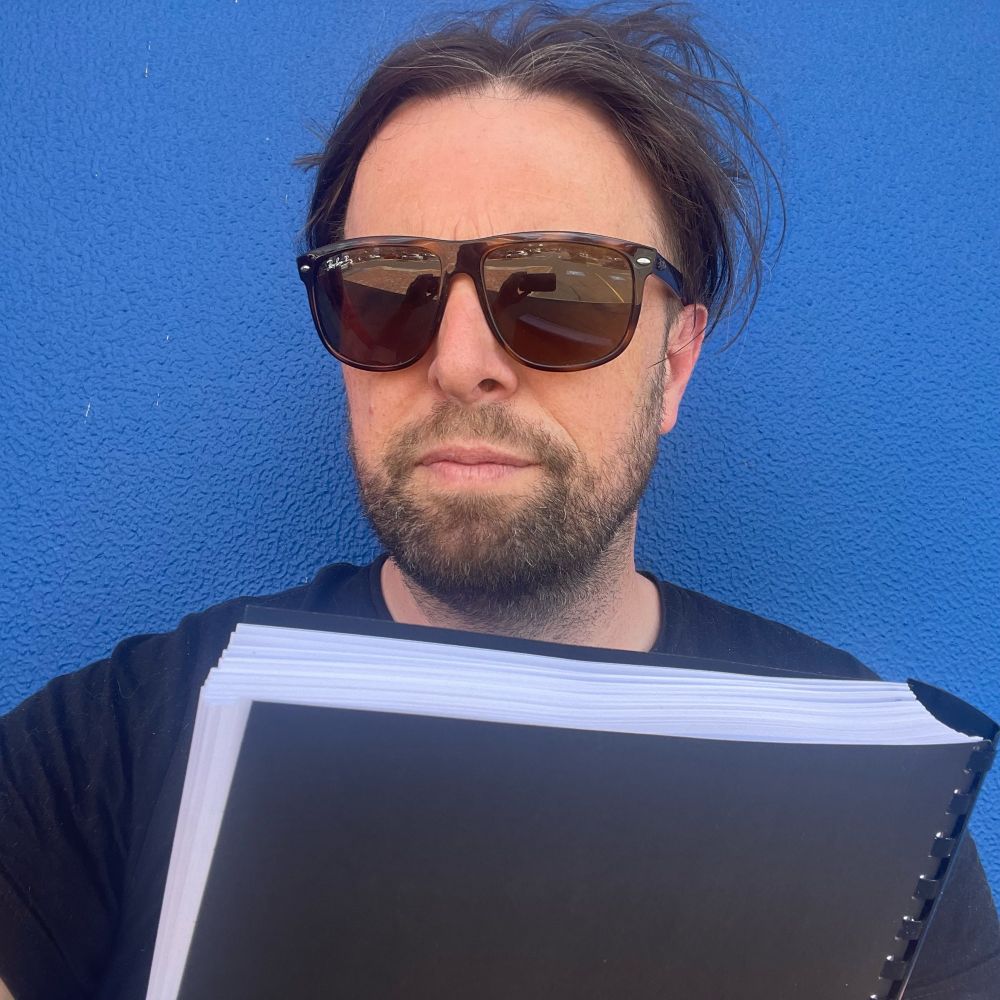 Paul with a bound manuscript of his forthcoming novel (ya bass)