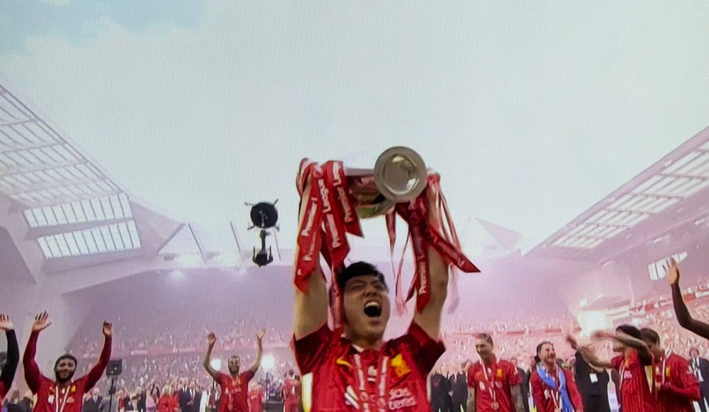 Wataru Endo lifting the Premier League trophy