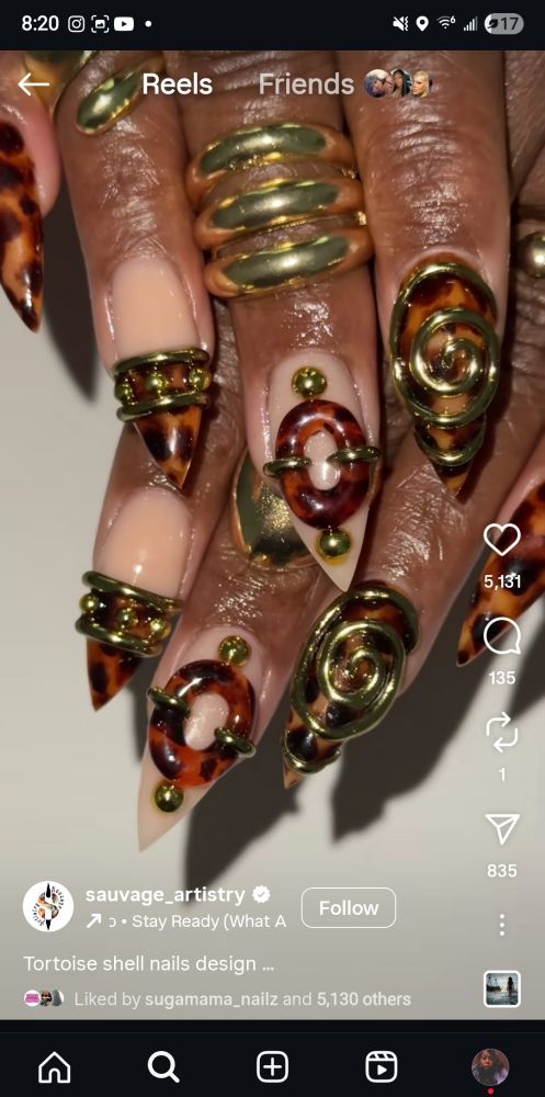 Gold and tortoise shell stiletto nail set on nude base