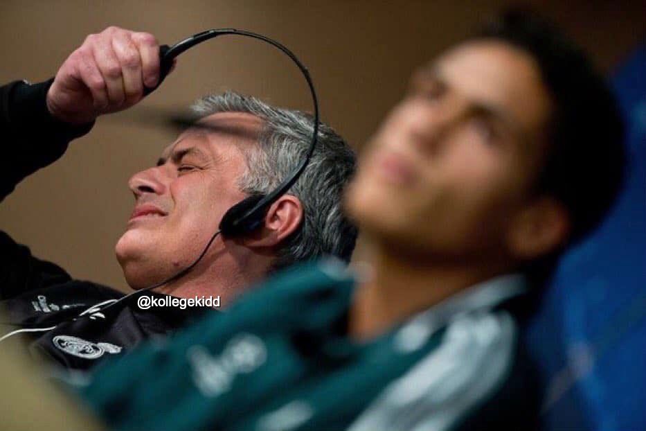 Jose Mourinho ripping off his headphones in disappointment