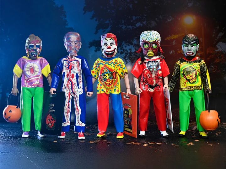 Action figures in a row, from left to right: a zombie, an invisible skin person, a clown, a... brain monster from... I can't remember the movie. It's a classic. And a Dracula.

Most of the characters have chest images that duplicate their masks.

This Island Earth! I think that's where the alien is from. I refuse to go look. Big eyes, exposed brain, claw hands.

The invisible skin kid is my favorite. His body costume is of a circulatory system and his mask is transparent plastic with red and blue veins visible.