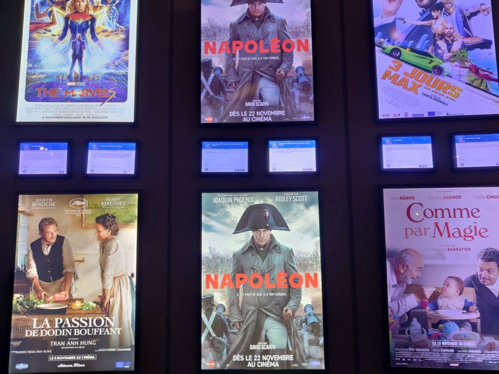 Film posters including Napoleon at a cinema