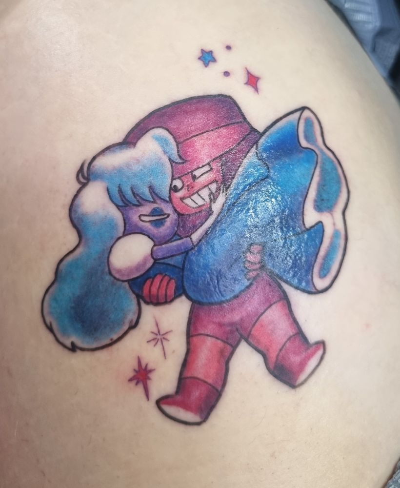 A fresh tattoo of Ruby holding Sapphire in her arms. They both look incredibly happy. 