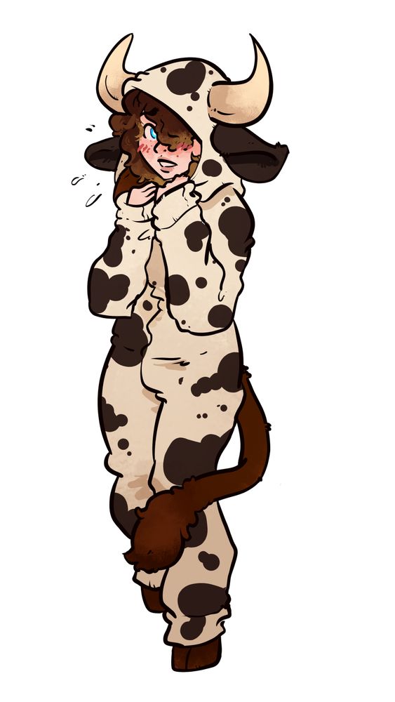 Minnie looking shy and bundled up in a cow themed kigu