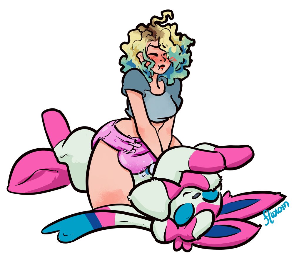 Same image as above but Holly leans forward and is making a very focused expression
