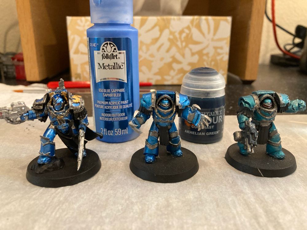 Three catephractii terminators for Warhammer The Horus Heresy, painted in three different shades of blue.