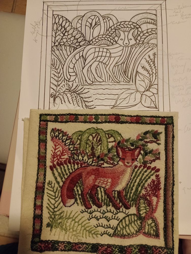 Photo of the same embroidered fox below with a black and white drawing of the design  in pen and pencil above