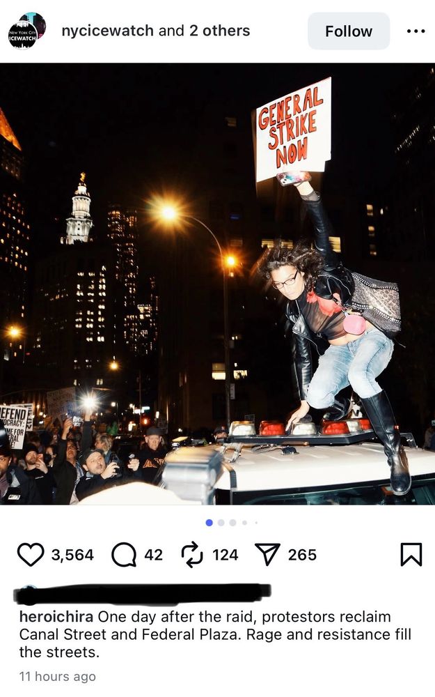 A photo from instagram of a woman in NYC on top of a police car holding a sign that says “General strike now”