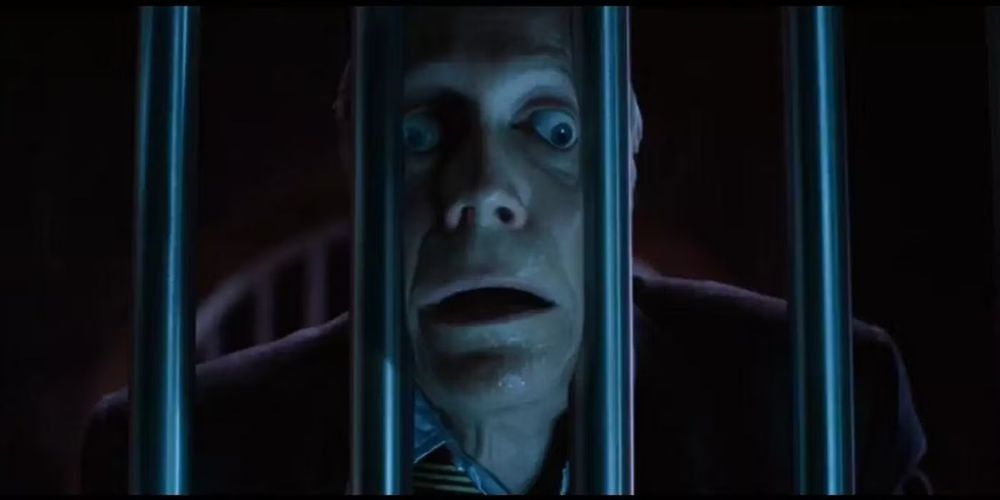 Senator Kelly from the first X-men movie, squeezing between prison bars.