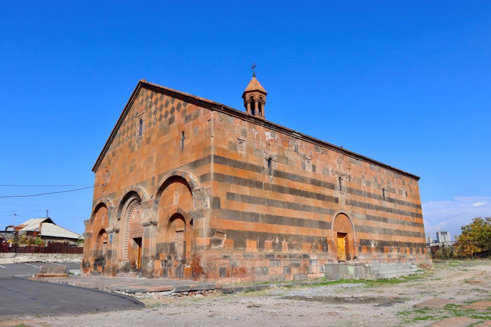view of the church from the unforested section of cemetery grounds