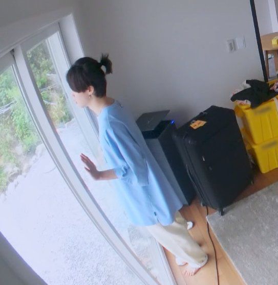 Jimin staring longingly out of the window 