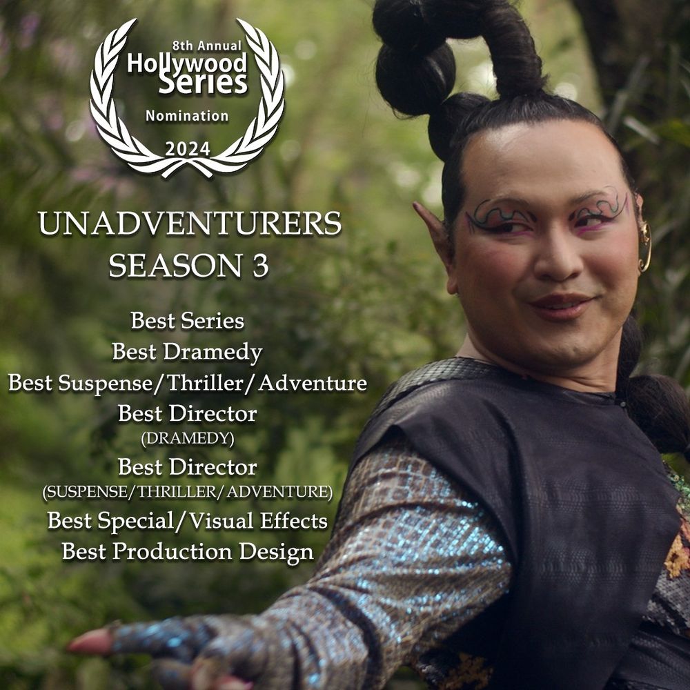 Vega, a ladina meio-elfa não-binária dando uma giradinha em seu eixo, apontando o dedo para trás e sorriso confiante. Vega é interpretada por Ü von Haus. Pessoa não binária andrógina, amarela, com cabelos pretos e estatura mediana.
Há um louro do festival Hollywood Series 2024, texto dizendo UNADVENTURERS SEASON 3 e a lista de indicações:
BEST SPECIAL / VISUAL EFFECT
BEST PRODUCTION DESIGN
BEST SUSPENSE / THRILLER / ADVENTURE
BEST DIRECTOR - SUSPENSE / THRILLER / ADVENTURE
BEST DRAMEDY
BEST DIRECTOR - DRAMEDY
BEST SERIES 
