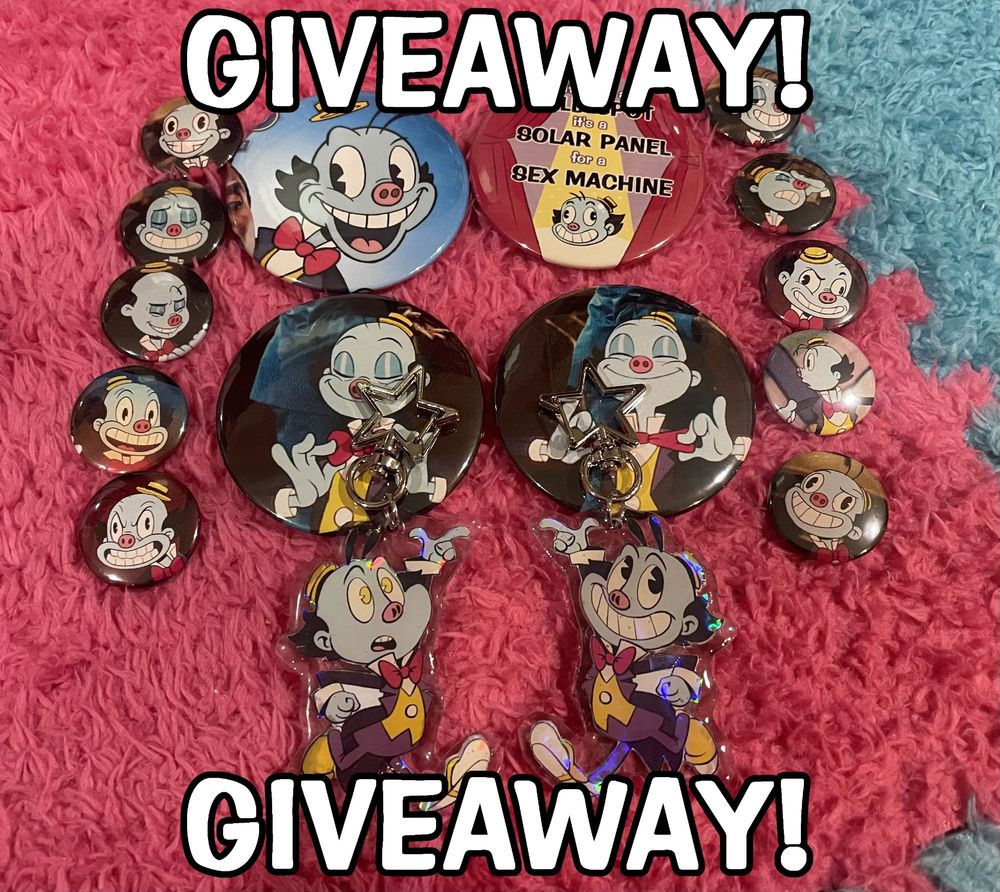 A photograph of an organized assortment of Mr. Ring-a-Ding / Lux Imperator merch. There are 2 keychains and 14 buttons all neatly organized, sitting on a plush pink and blue carpet. There is text on the image that says "Giveaway!"