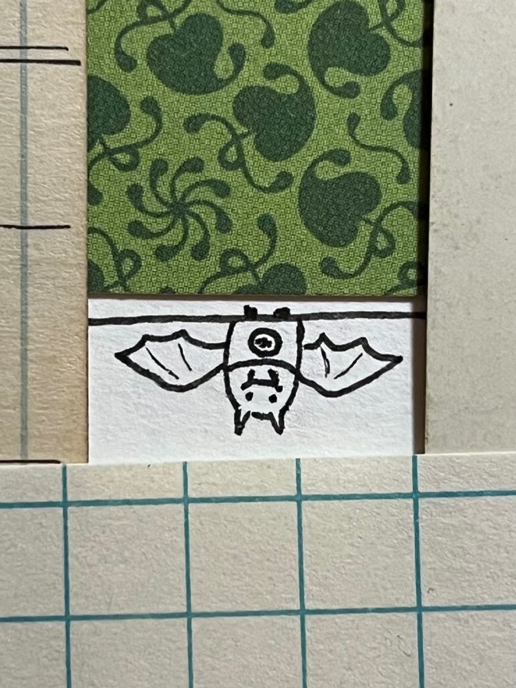 Ink illustration of a happy bat hanging upside down with wings outstretched