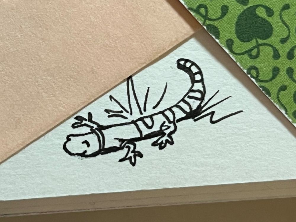 Ink illustration of a cheerful salamander wearing a t-shirt