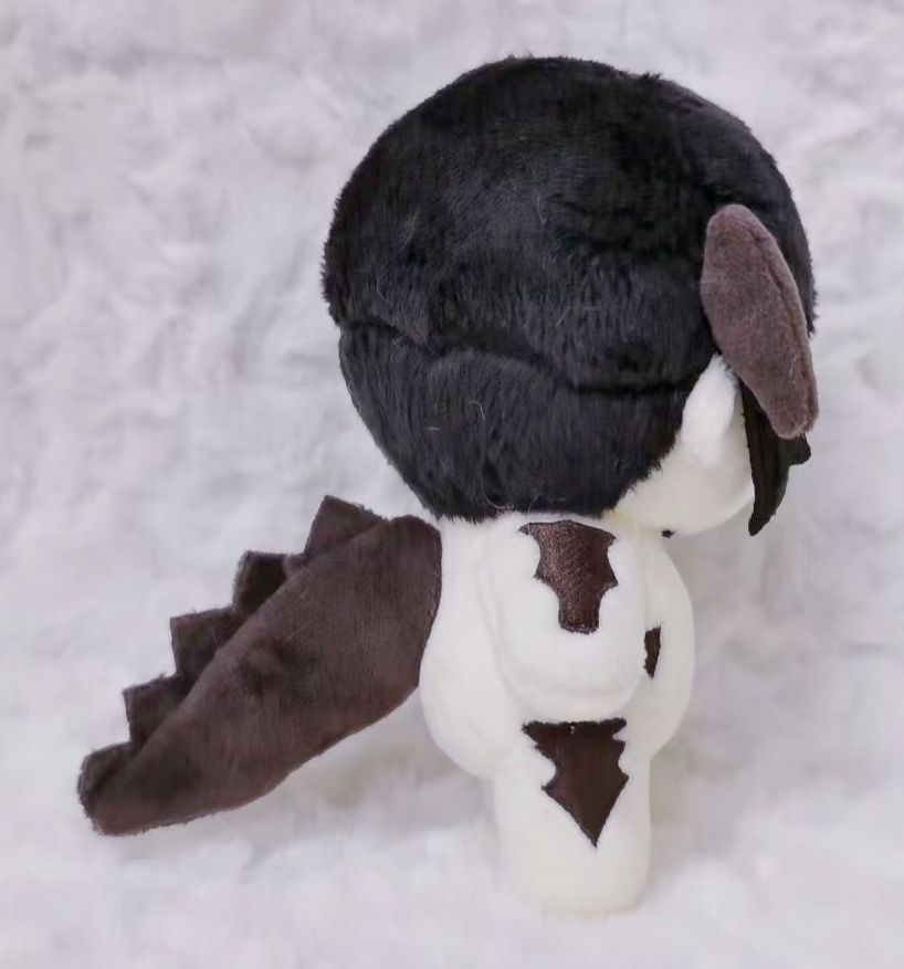 side view of a wip peony plush with a big ol tail