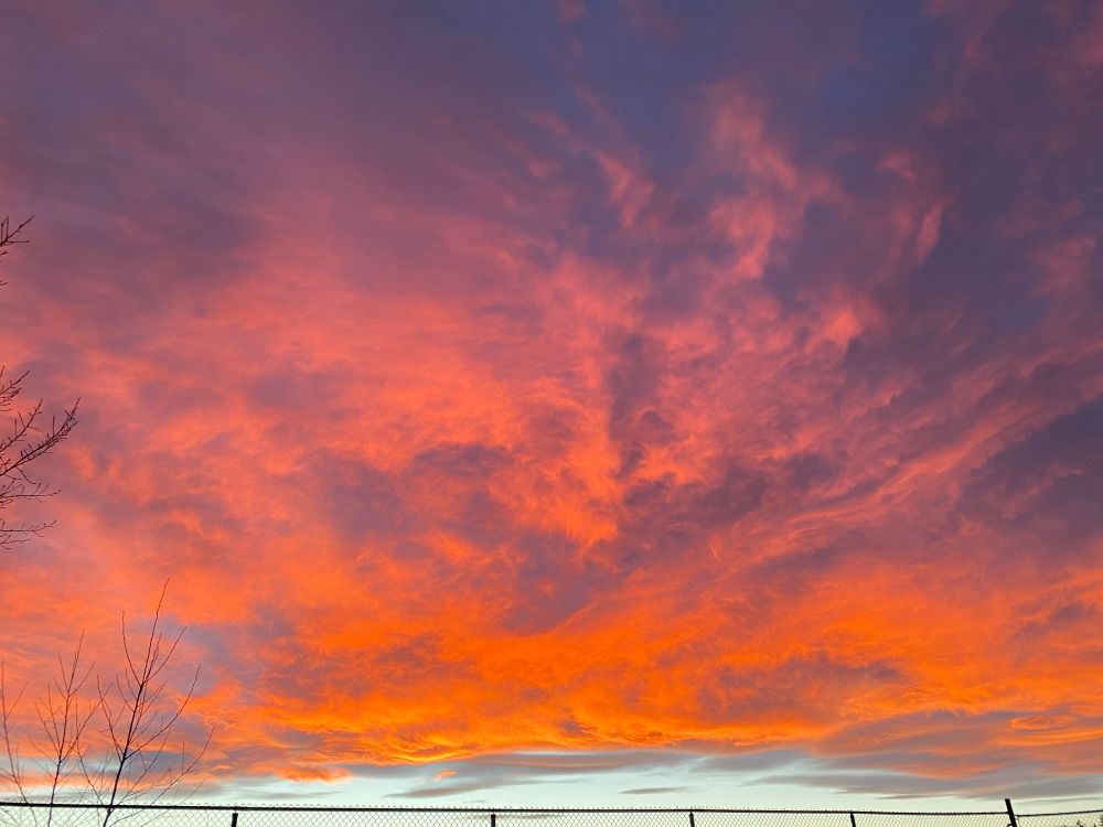 Clouds turned orange by the setting sun