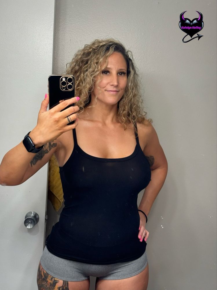 Selfie of Katelyn Hatley in a tank top and boy shorts 