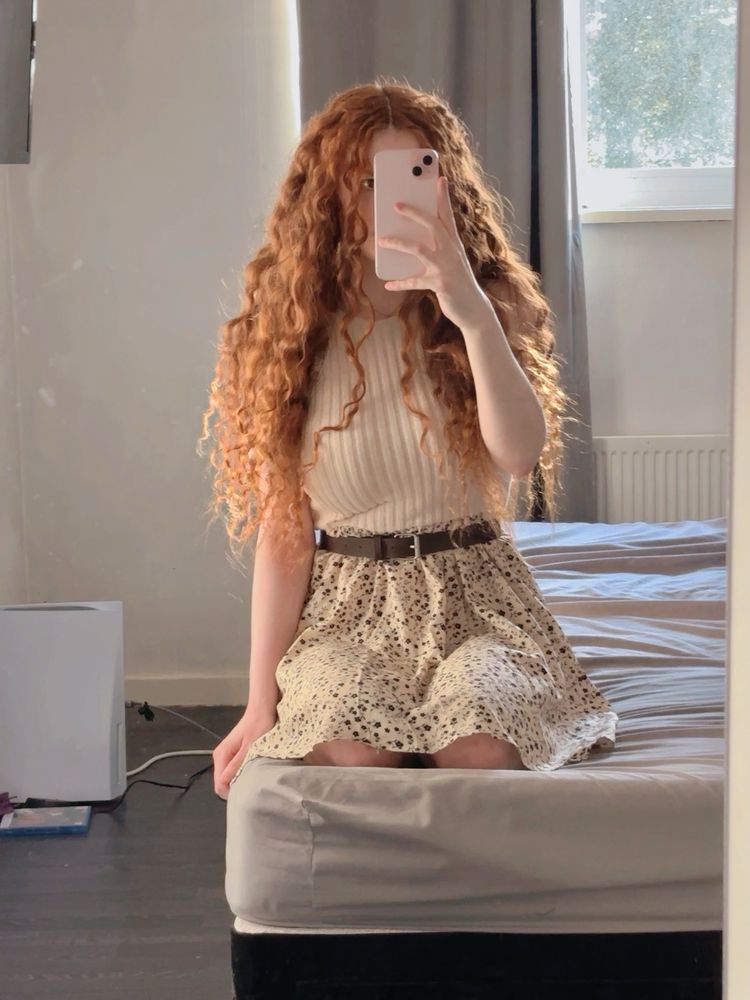 Me on the bed, I’m wearing a dress! 