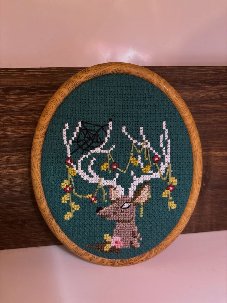 A cross stitch I did of an ethereal looking stag 