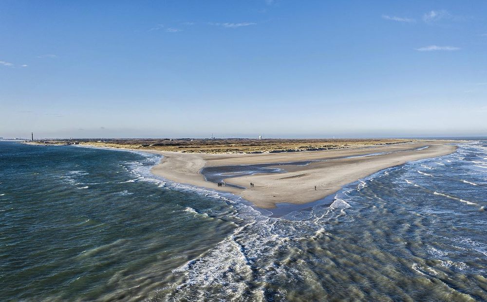 Picture of Skagen’s Grenen Beach at the convergence of the Skagerrak and Kattegat seas (Baltic and North seas). Where the seas meet the waves knock together and a slight colour difference can be seen.  

