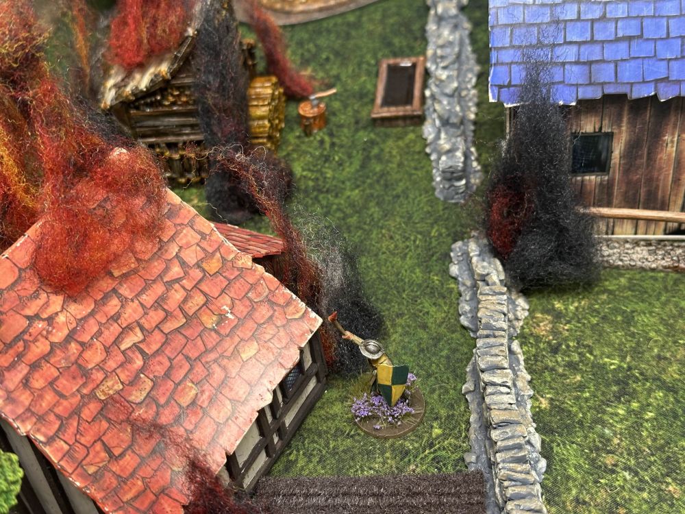 A sergeant in Baron's War setting fire to village buildings.