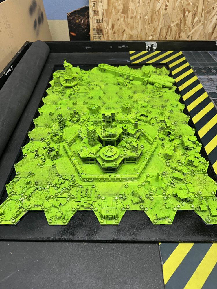 A very, very bright green map of a 40K hive city.
