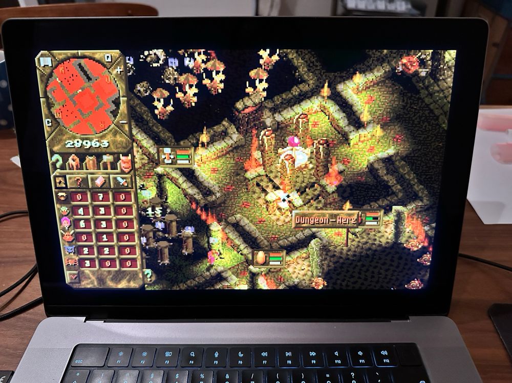 Photo of Dungeon Keeper video game running on my laptop.