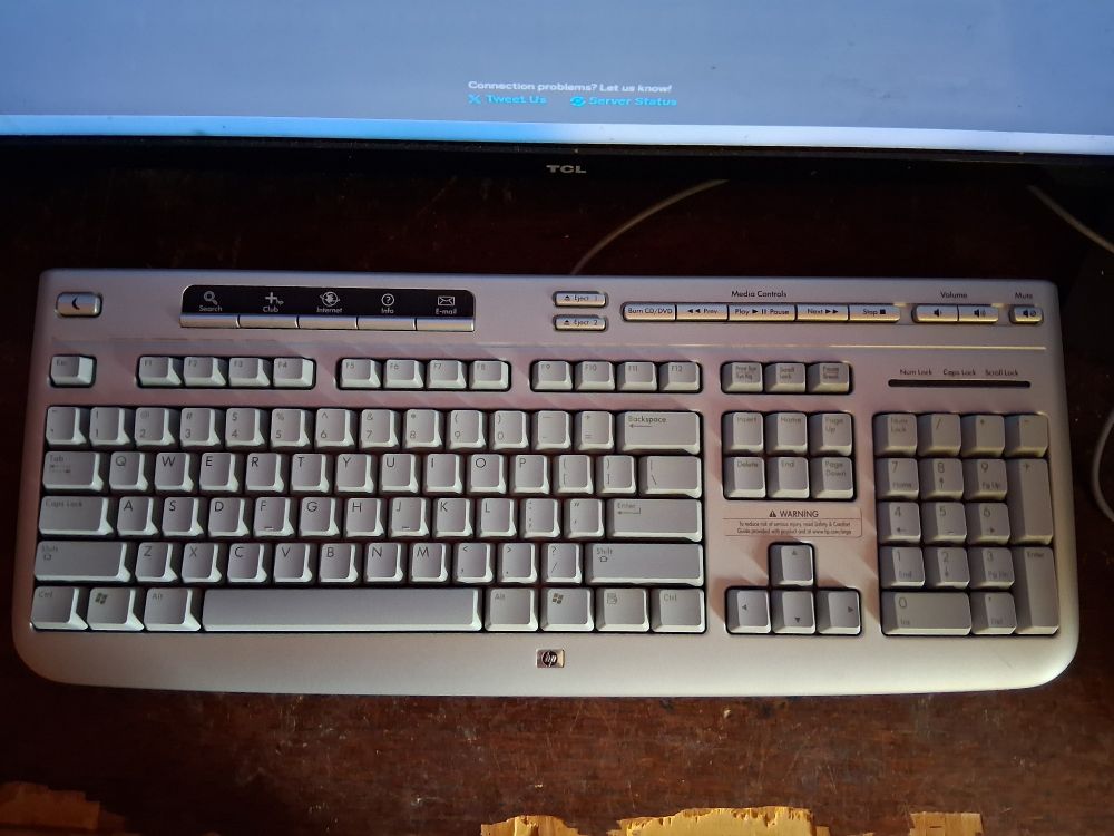 A light grey keyboard from what looks like the 2000s