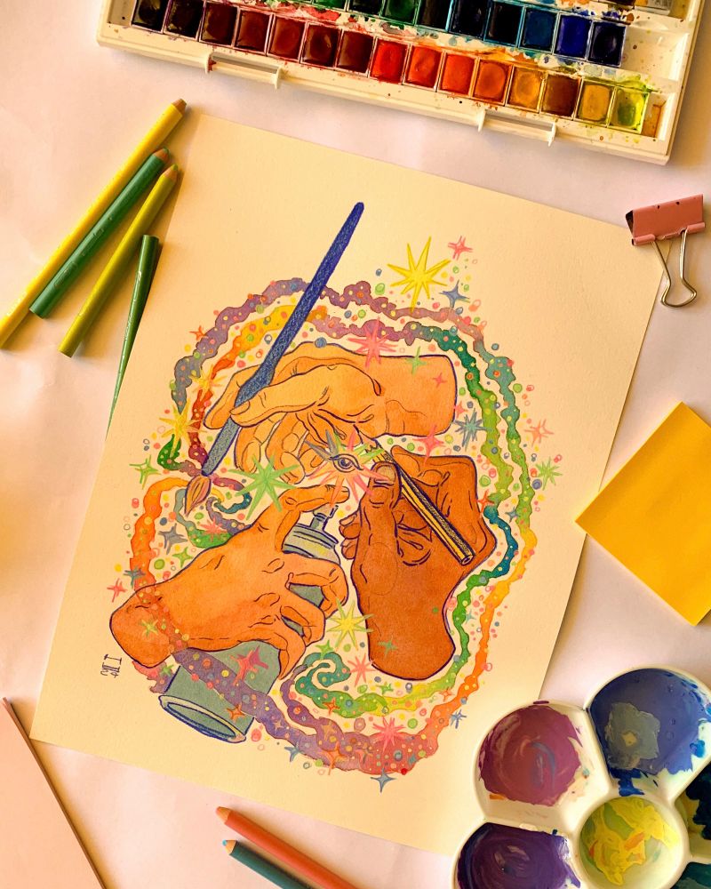 Picture of a painting, surrounded on all sides by different art supplies: a watercolor palette, a flower shaped color mixer, colored pencils, sticky notes and a pink paperclip. 
The painting, in the center of the image, depicts three different hands all holding a different tool. The lighter colored hand at the top holds a brush, which is pointed directly at the golden-brownish hand at the bottom, which holds a spray paint can pointed at the brown hand on the right, holding a pencil which points to the first hand. This movement in the action creates a circular visual effect in the piece, at the center of which there is a brightly multicolored star surrounding a human open eye. Around the hands are swirls of watercolor paint that surround he whole piece, in gradients of green to yellow to orange to fuchsia to purple and blue. On these watercolor swirls, a multitude of differently sized stars is painted with gouache, in pastel colors. 
