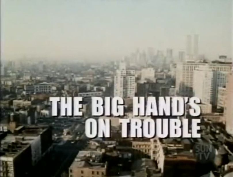 Titlecard from the television program BARETTA. In colour, though one that's faded, desaturated, and hazy with the degradation associated with decades-old multigenerational off-air consumer videorecording and subsequent digitisation.

A southward-gazing higher-angled shot of Manhattan, c.1974. Possibly taken from the higher floor or rooftop of a tall apartment or office building, the city is spread out before us in block after block of unidentifiable grey and reddish brick buildings. A wide thoroughfare* cuts upward through them on a slight diagonal from the frame's lower left corner. The Twin Towers of the World Trade Centre are distinct and visible in the greyish haze of the image's upper right corner, alone among a handful of unidentifiable lower-rising highrises.

A translucent station id bug appears in the image's bottom right corner; inside a dim grey circle the words "Sun TV" are detectable.**

Overlaid in the image's lower half, in a bold, headline-styled  white font with a thin black dropshadow, right-justified and split over two lines, "The Big Hand's on Trouble".

. 
*(feels like 2nd or 3rd Ave?  Maybe in East Harlem? Could be the South Bronx, although surely we'd then see the river somewhere, no?  Looks like there's a train crossing just left of centre. 3rd Ave El stopped running in '73. There's no telling the date of this clearly stock shot of the city. WTC was completed in '73, yeah? Eh, add it to the list of life's eternal mysteries, I guess. Okay have a good one, everybody.)


**(which dates this recording between the Septembers of 2005 and 2007 where, in addition to its low-rent,  vacuous "lifestyle" programming, Sun strip-ran vintage teevee from a closet in downtown Toronto, just before Quebecorp's mercifully failed attempt to jerry-rig it into a rebranded crosscountry homegrown Fox News variant. It thereafter bottomed quickly out and disappeared forever. And dat's da nam'o' dat tune.)


#tvsky
#TVSky
#classictv
#ClassicTV
#filmsky
#tvhistory