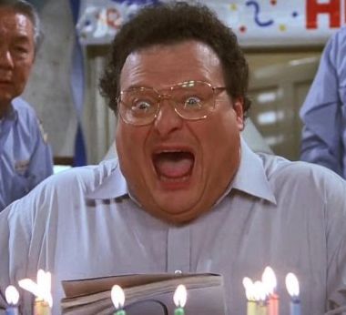 Wayne Knight as his character Newman, a postman, from the series Seinfeld. In the picture he is caught in the middle of blowing out his birthday candles