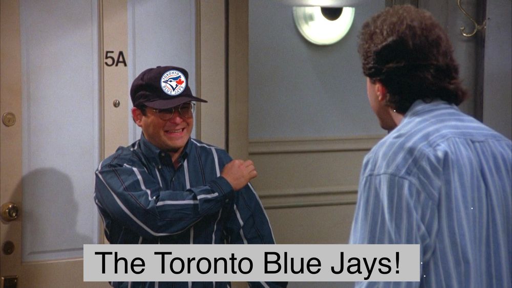 George Costanza wearing a Toronto Blue Jays hat saying The Toronto Blue Jays!