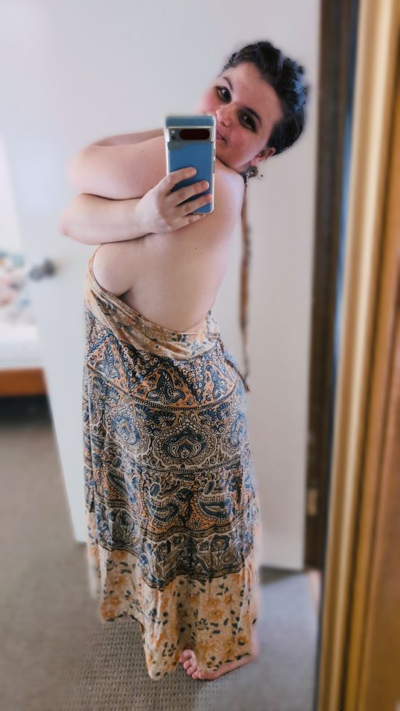 Berni smiling with a pretty skirt/dress n gorgeous side boob 